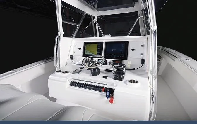 Slide: The Image of 2024 Invincible 42 boat cockpit with advanced navigation systems and controls. - 12