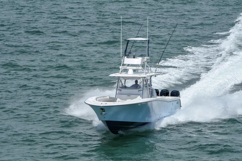 Slide: The Image of 2024 Invincible 42 boat cruising on open water. - 3