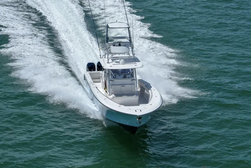 Slide: The Image of 2024 Invincible 42 boat cruising on open water. - 4