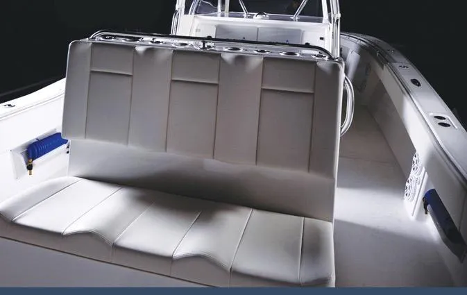 Slide: The Image of 2024 Invincible 42 boat interior with cushioned seating and modern design. - 6