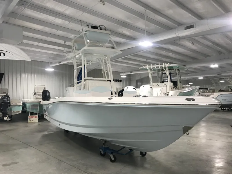 The Image of 2024 Robalo 246 Cayman Sky Deck boat in showroom. - 1