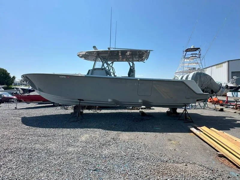 Slide: The Image of 2021 SeaVee 370z boat on dry dock, side view, clear sky background. - 18