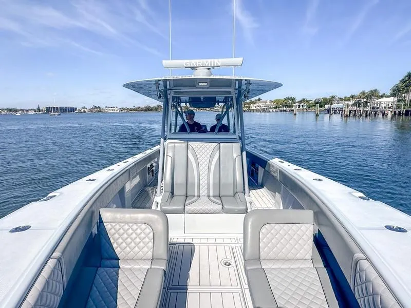 Slide: The Image of 2021 SeaVee 370z boat on calm water, featuring spacious seating and modern design. - 25