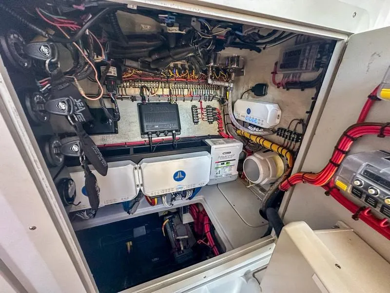 Slide: The Image of Electrical system inside a 2021 SeaVee 370z boat, showcasing wiring and components. - 39