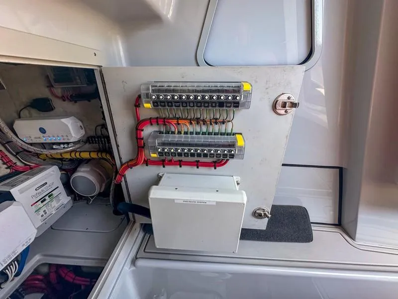 Slide: The Image of Electrical panel inside a 2021 SeaVee 370z boat, showcasing wiring and components. - 40