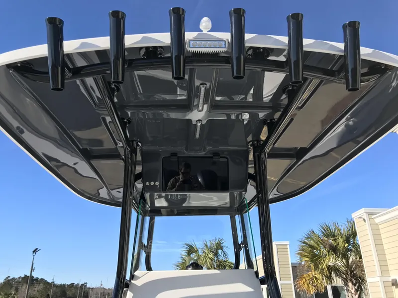 Slide: The Image of 2024 Cape Horn 27 XS boat with T-top and rod holders. - 16