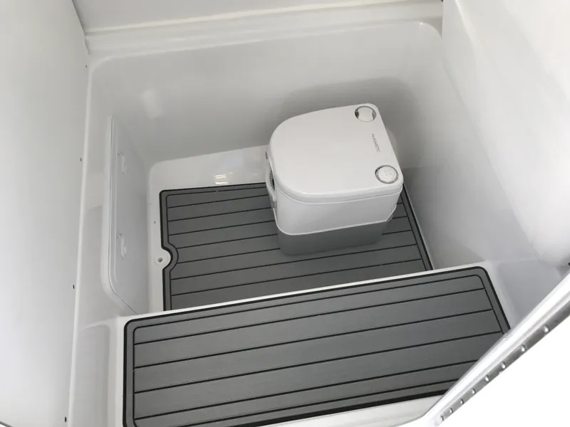 Slide: The Image of 2024 Cape Horn 27 XS boat interior with portable toilet. - 17