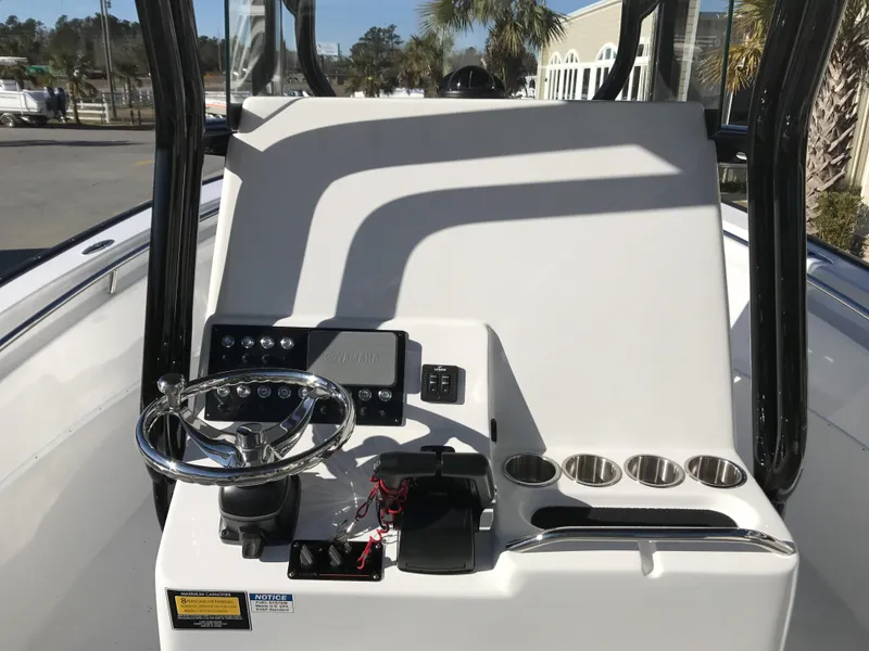 Slide: The Image of 2024 Cape Horn 27 XS boat console with steering wheel and control panel. - 6