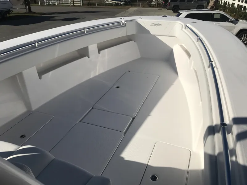 Slide: The Image of 2024 Invincible 36 boat interior with spacious deck and storage compartments. - 12