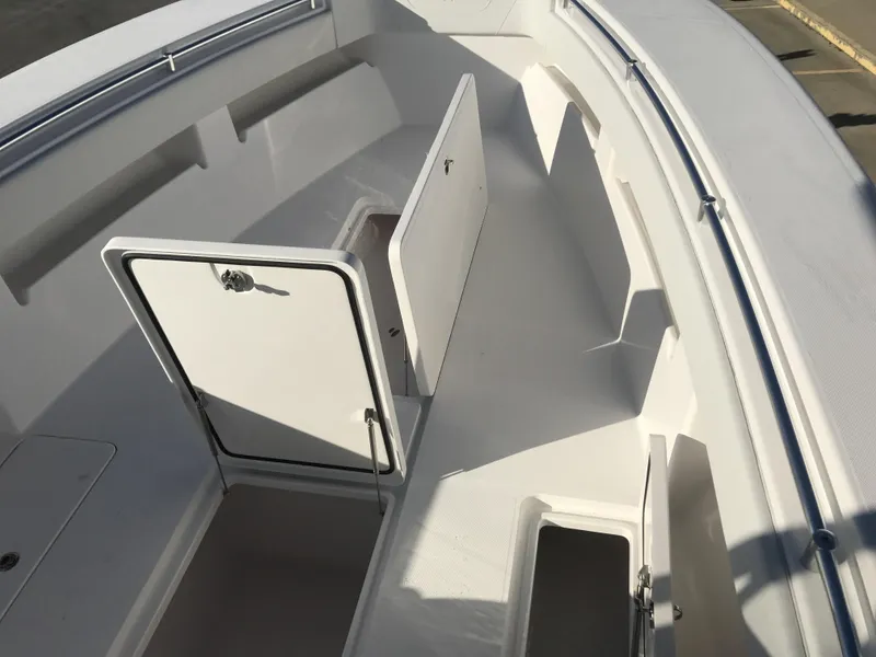 Slide: The Image of 2024 Invincible 36 boat interior with open storage compartments. - 13