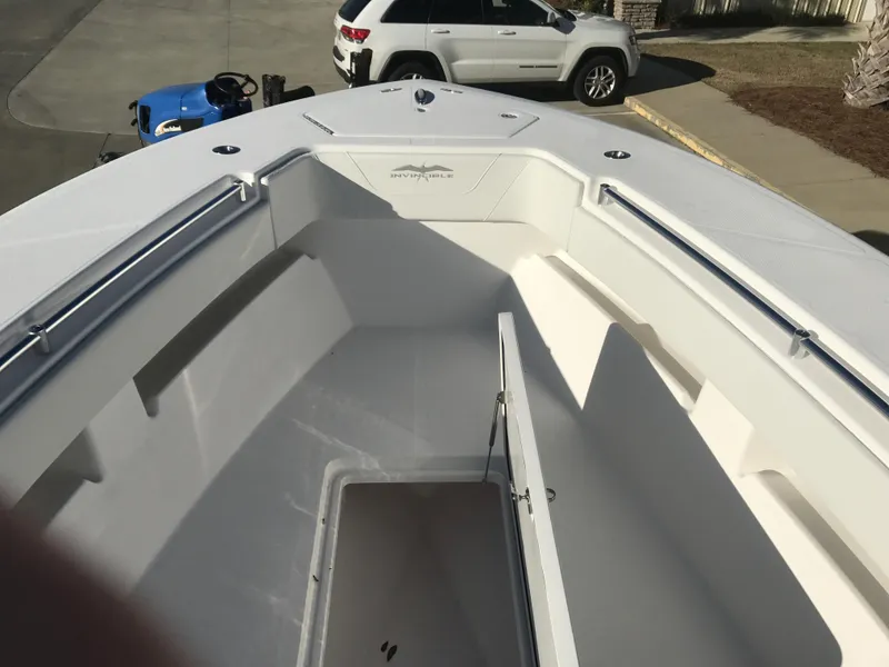 Slide: The Image of 2024 Invincible 36 boat interior with open storage compartment. - 14