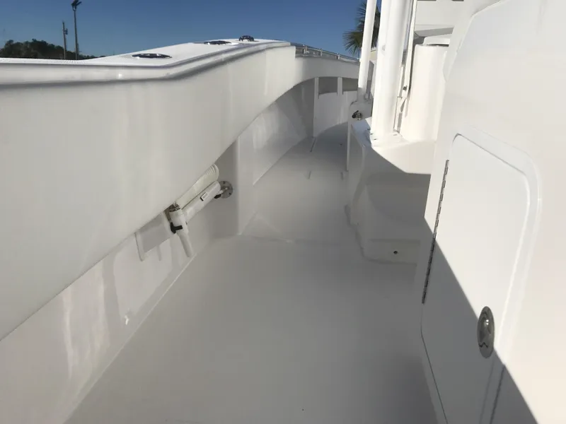 Slide: The Image of 2024 Invincible 36 boat deck with white finish and storage compartments. - 23