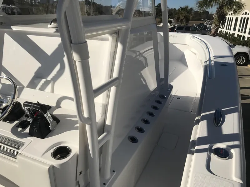 Slide: The Image of 2024 Invincible 36 boat deck with rod holders and console. - 7
