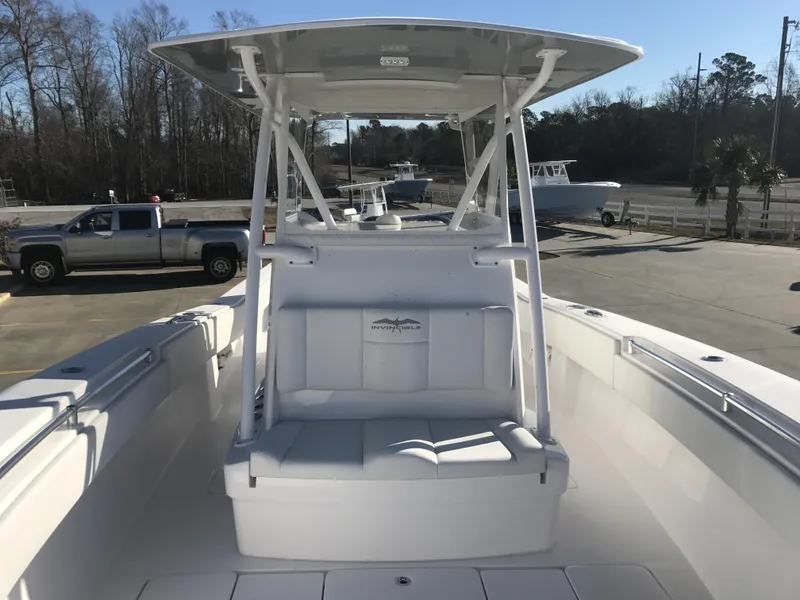 Slide: The Image of 2024 Invincible 36 boat with center console and seating, docked at marina. - 8