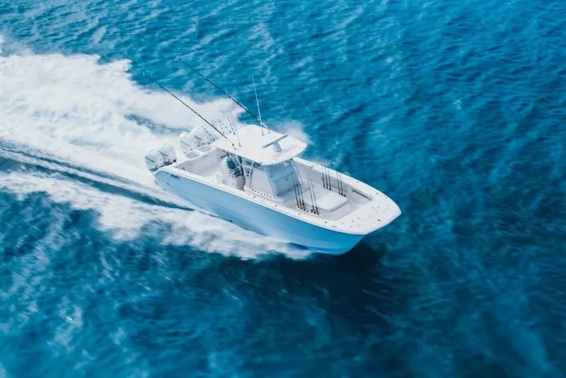 Slide: The Image of 2024 Invincible 40 Catamaran cruising on blue ocean waters. - 7