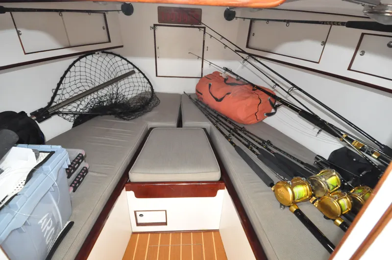 Slide: The Image of 1974 Bertram 31 Sportfisher cabin with fishing gear and storage. - 12