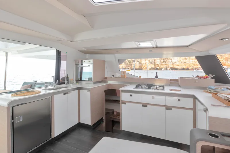 Slide: The Image of Modern kitchen interior of 2024 Fountaine Pajot Elba 45 catamaran with ocean view. - 11