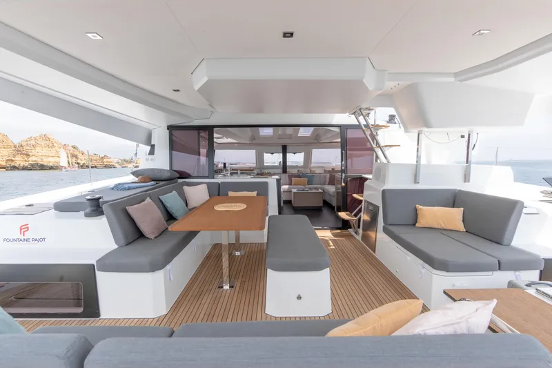 Slide: The Image of 2024 Fountaine Pajot Elba 45 yacht interior with spacious seating and dining area. - 5