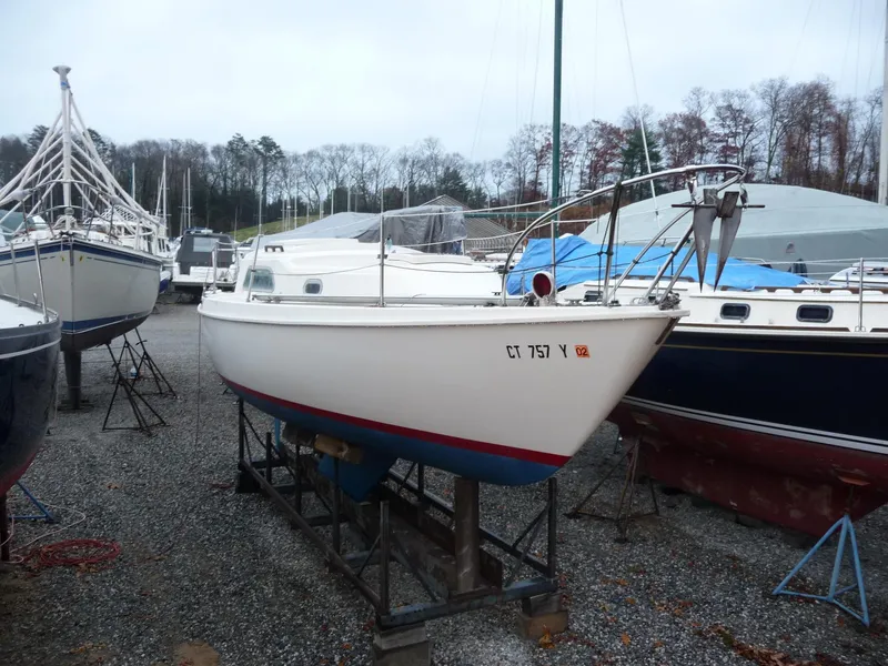 The Image of 1975 Pearson 26 sailboat on a stand in a boatyard. - 0