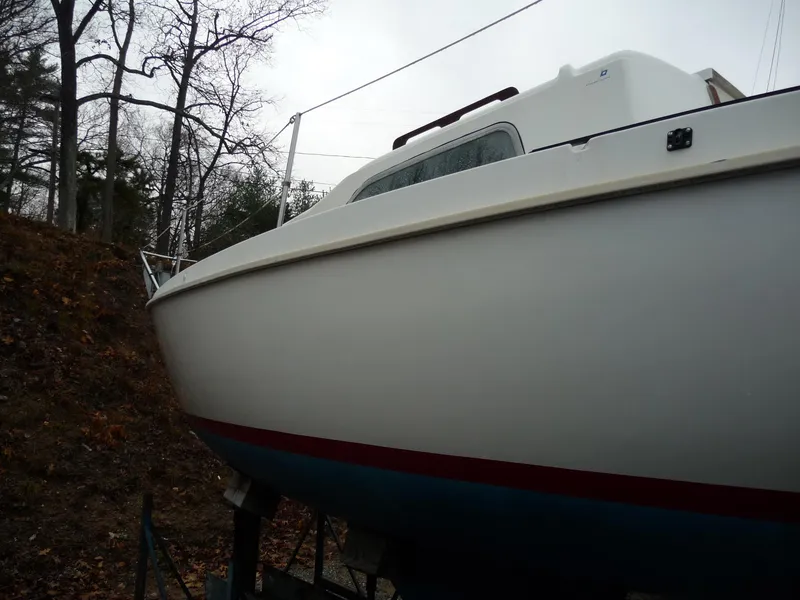 Slide: The Image of 1975 Pearson 26 sailboat on land, side view. - 2
