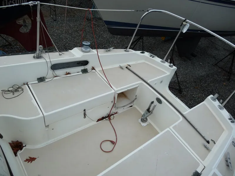 Slide: The Image of 1975 Pearson 26 sailboat cockpit with storage compartments and rigging. - 4