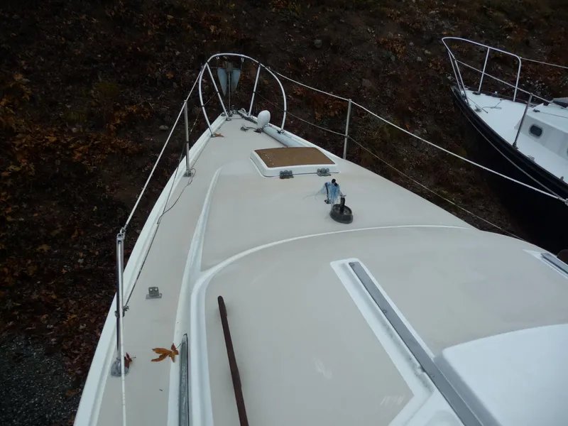 Slide: The Image of 1975 Pearson 26 sailboat deck view with railing and hatch. - 5