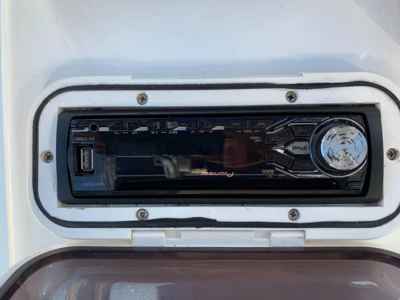 Slide: The Image of Pioneer car stereo in a 2016 Renegade 25 Center Console boat. - 10