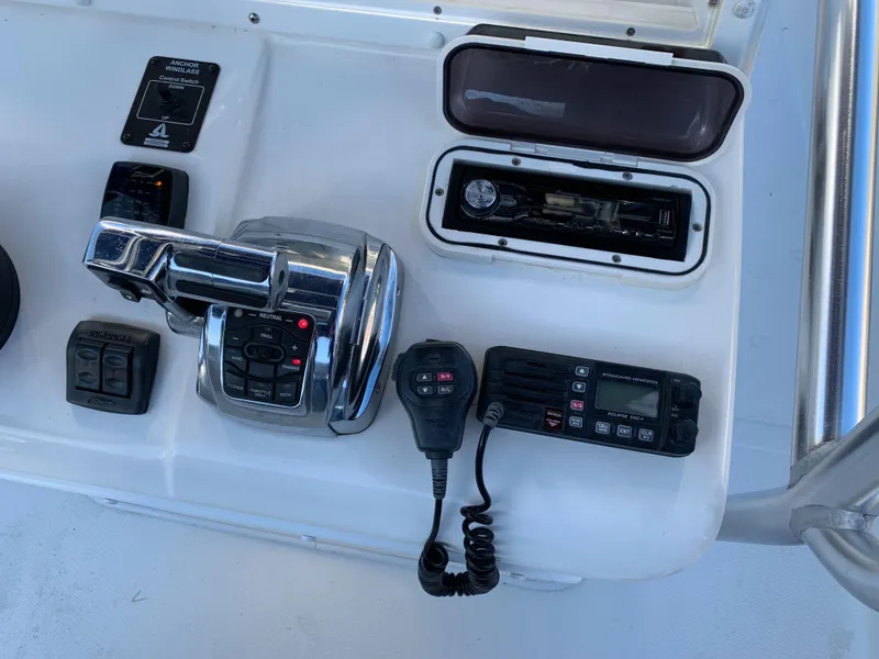 Slide: The Image of Control console of a 2016 Renegade 25 Center Console boat. - 11