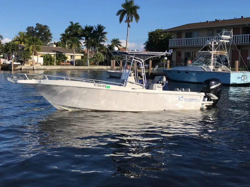 Slide: The Image of 2016 Renegade 25 Center Console boat on calm water. - 2