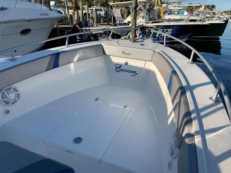 Slide: The Image of 2016 Renegade 25 Center Console boat docked at marina. - 21