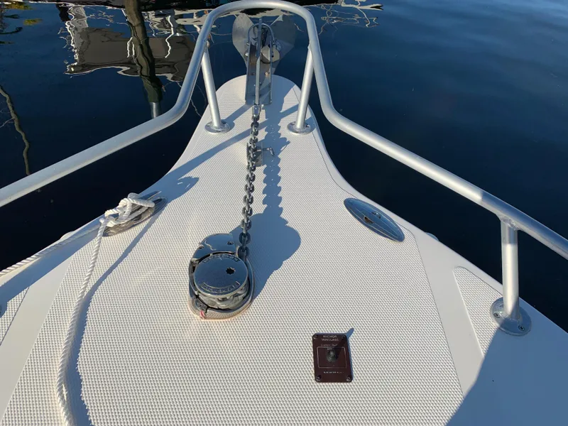 Slide: The Image of Bow of a 2016 Renegade 25 Center Console boat with anchor. - 23