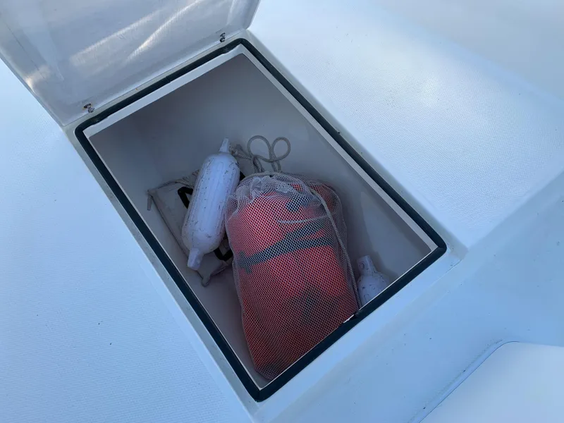 Slide: The Image of Storage compartment in 2016 Renegade 25 Center Console boat. - 27