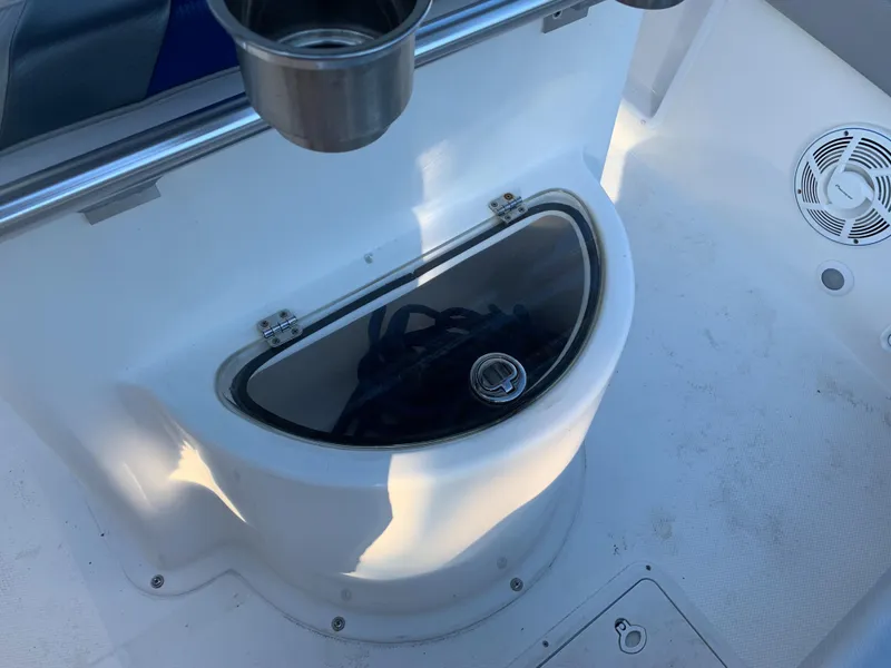 Slide: The Image of Renegade 25 Center Console 2016, boat console with storage compartment. - 33