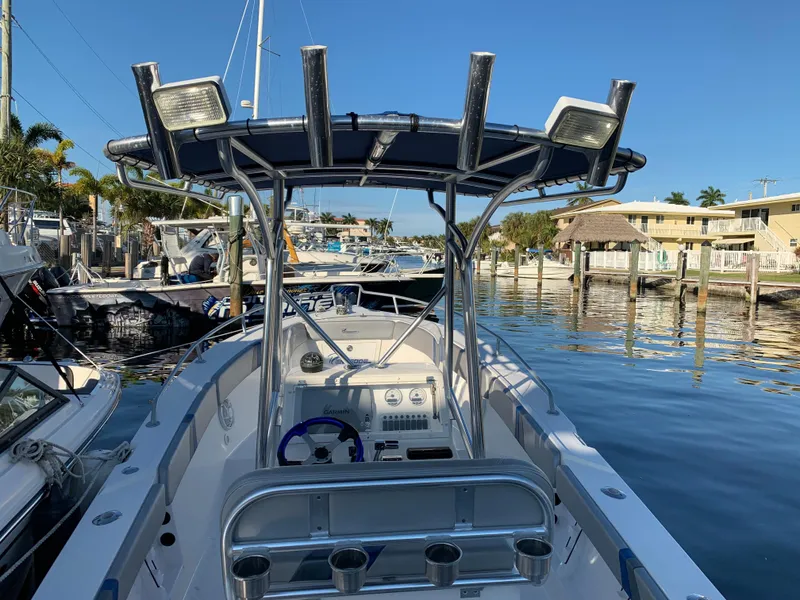 Slide: The Image of 2016 Renegade 25 Center Console boat docked at marina. - 4