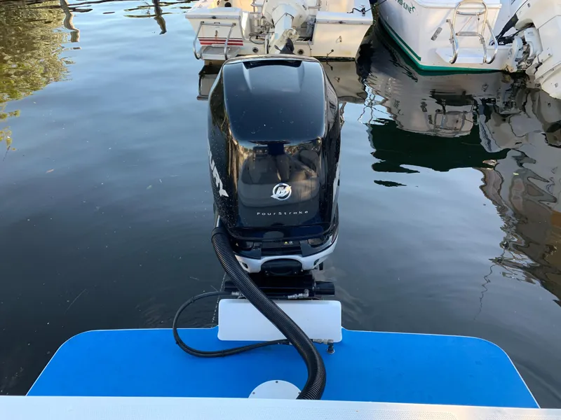 Slide: The Image of Outboard motor of a 2016 Renegade 25 Center Console boat. - 7