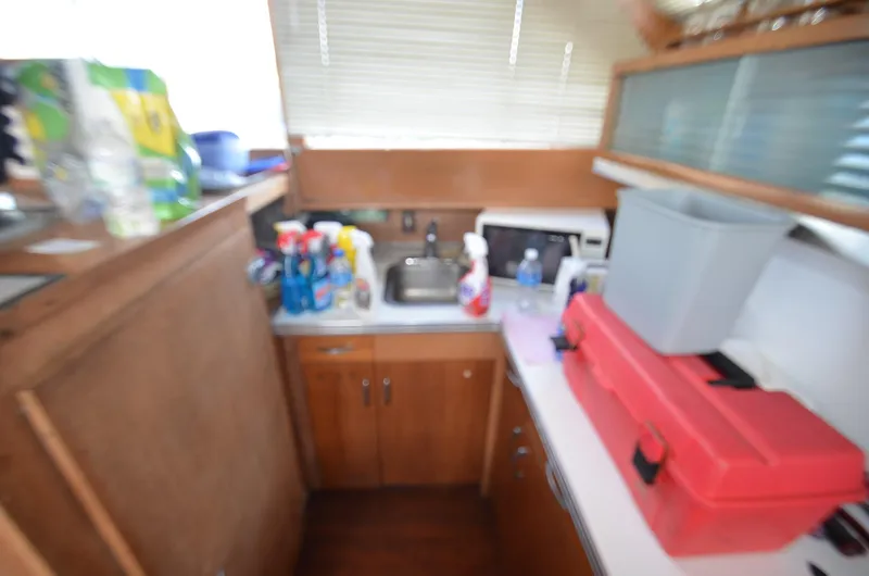 Slide: The Image of Small kitchen area in a 1964 Chris-Craft Constellation boat. - 15