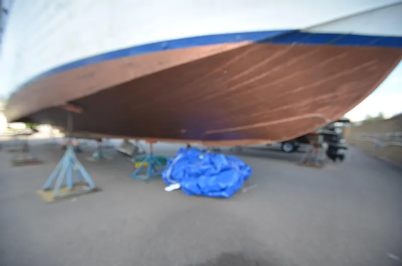 Slide: The Image of 1964 Chris-Craft Constellation boat hull on stands for maintenance. - 3