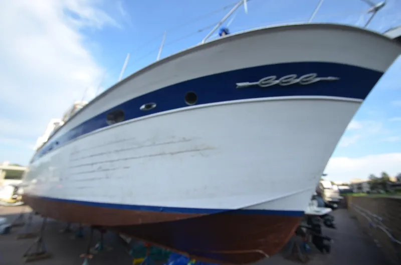 Slide: The Image of 1964 Chris-Craft Constellation boat on dry dock for maintenance. - 4