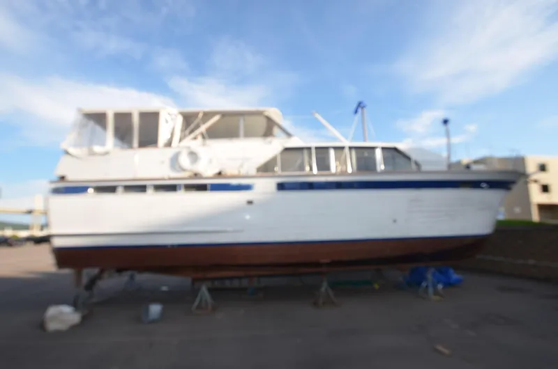 Slide: The Image of 1964 Chris-Craft Constellation boat on dry dock for maintenance. - 8