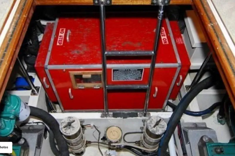 Slide: The Image of Engine room of 1988 Kadey-Krogen Silhouette with visible pipes and machinery components. - 13