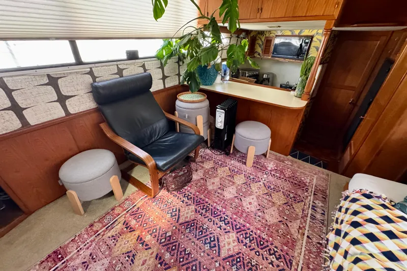 Slide: The Image of Cozy 1988 Kadey-Krogen Silhouette interior with colorful cushions and patterned rug. - 17