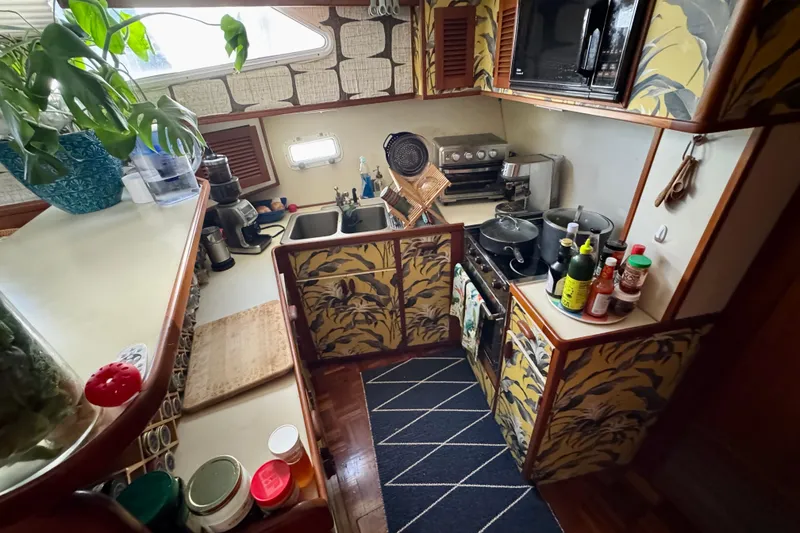 Slide: The Image of Compact 1988 Kadey-Krogen Silhouette bathroom with toilet, sink, and shower curtain. - 26