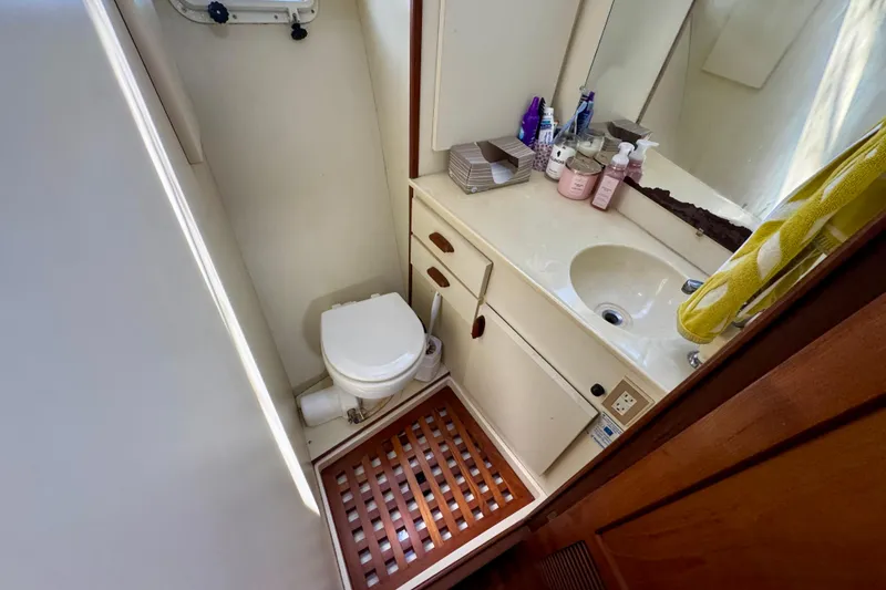 Slide: The Image of Open refrigerator on 1988 Kadey-Krogen Silhouette yacht, stocked with various food items. - 30