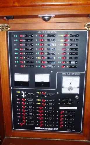 Slide: The Image of Cozy 1988 Kadey-Krogen Silhouette cabin interior with bed and seating area. - 34