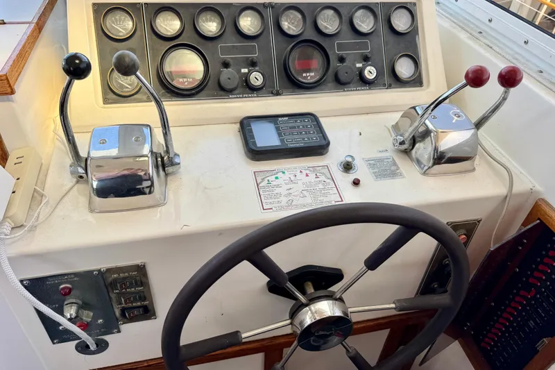 Slide: The Image of 1988 Kadey-Krogen Silhouette 42 yacht named "Escapade" with sleek design details. - 5