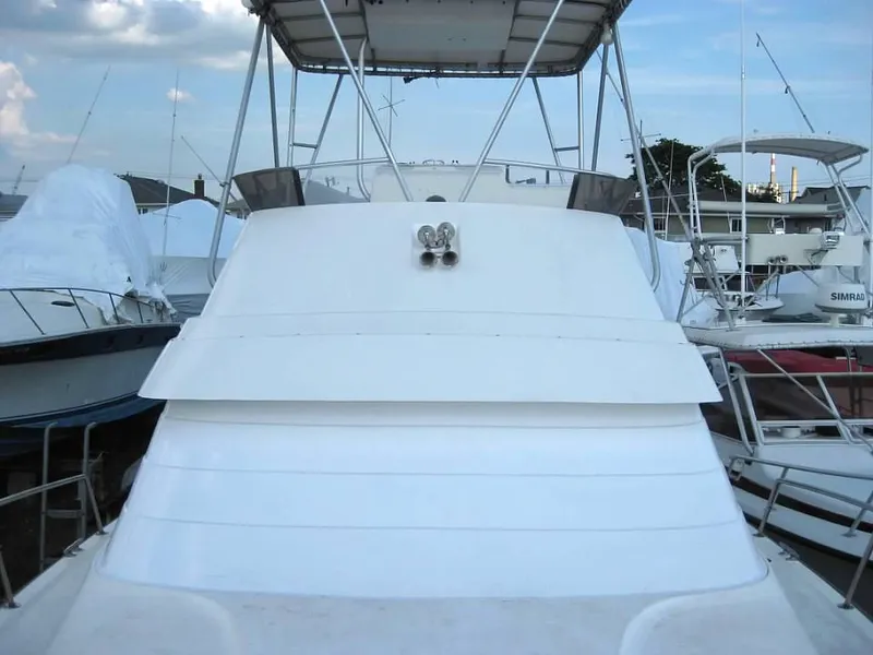 Slide: The Image of 1989 Luhrs 342 Tournament boat docked at a marina. - 5