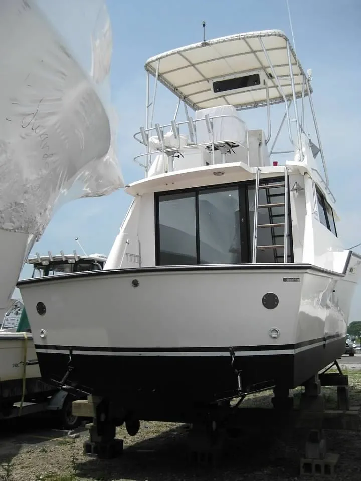 Slide: The Image of 1989 Luhrs 342 Tournament boat on dry dock, rear view. - 7