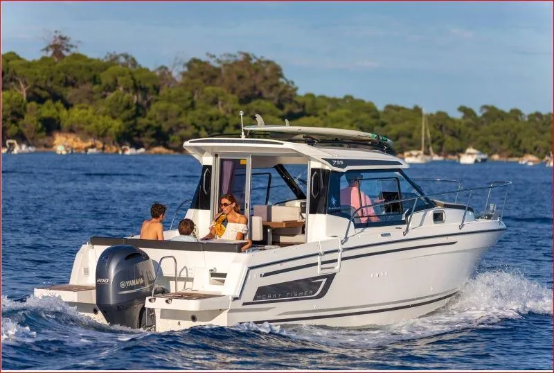 Slide: The Image of 2024 Jeanneau NC 795 motorboat cruising with passengers on a sunny day. - 7