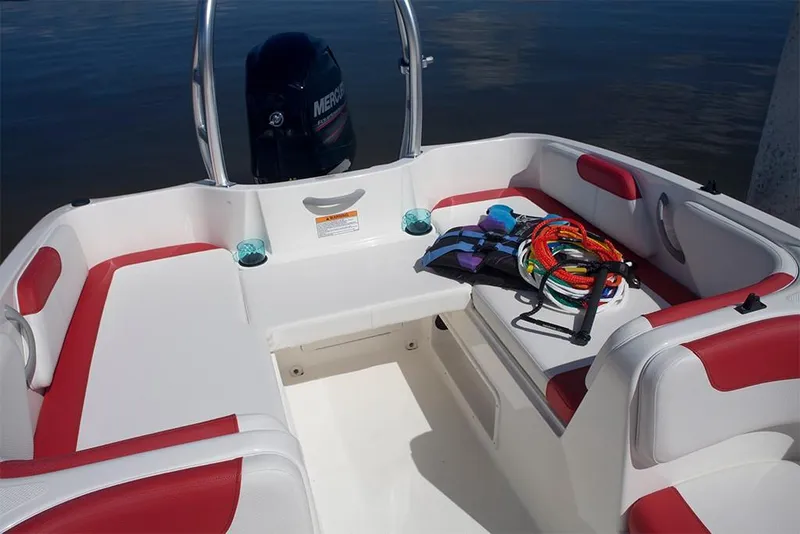 Slide: The Image of 2023 Bayliner Element E18 boat interior with red and white seating, life jackets, and ropes. - 16
