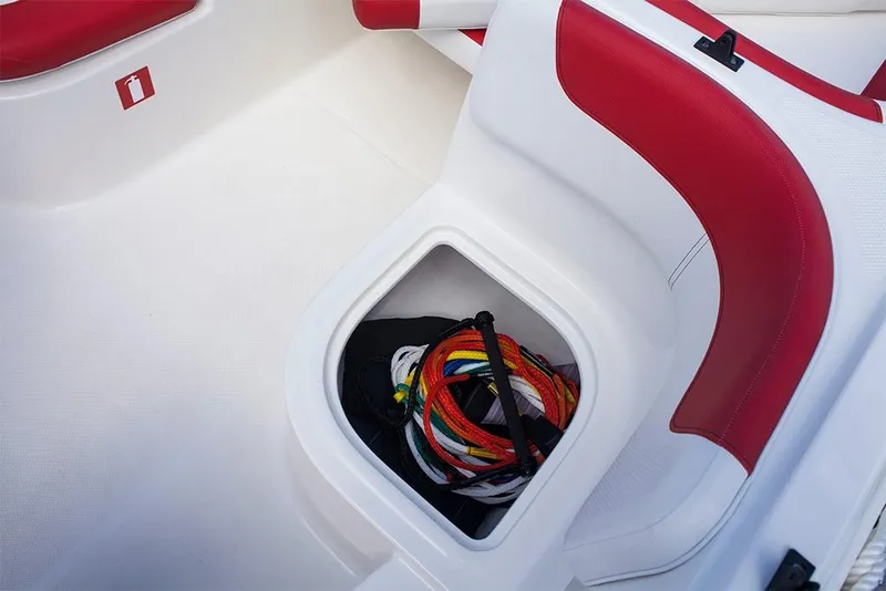 Slide: The Image of 2023 Bayliner Element E18 boat storage compartment with colorful ropes. - 21